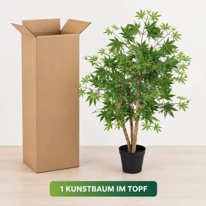 Lieferumfang: künstlicher Japanischer Ahorn im schwarzen Topf neben dem geöffneten Versandkarton